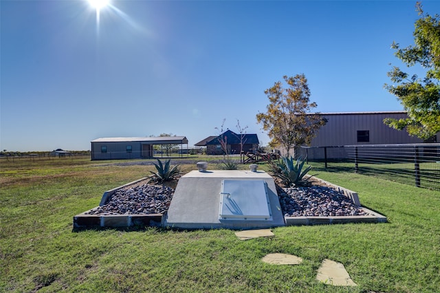 view of storm shelter featuring a yard and an outbuilding