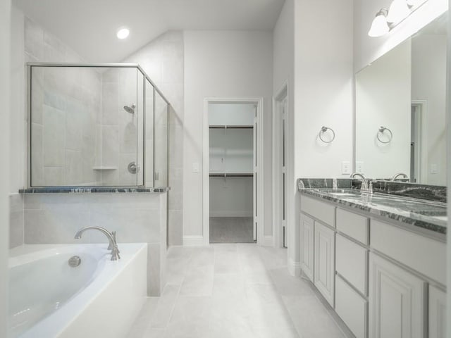 bathroom with vanity, tile patterned flooring, and separate shower and tub