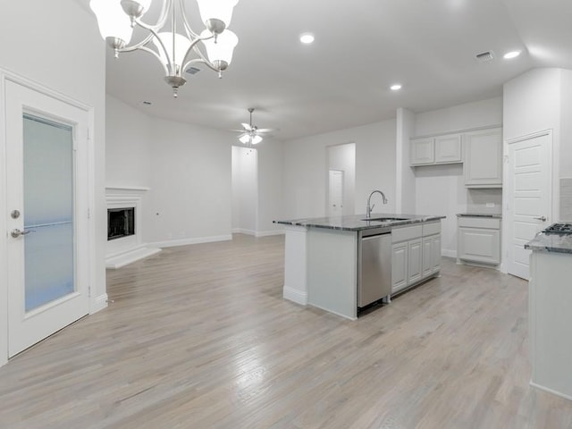 kitchen with sink, white cabinetry, a center island with sink, dishwasher, and pendant lighting