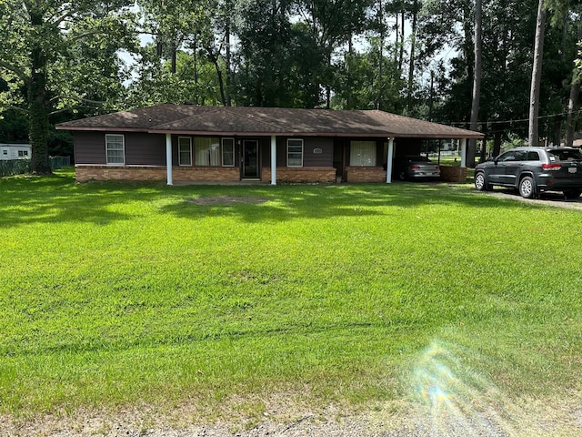 ranch-style home with a front lawn and a carport