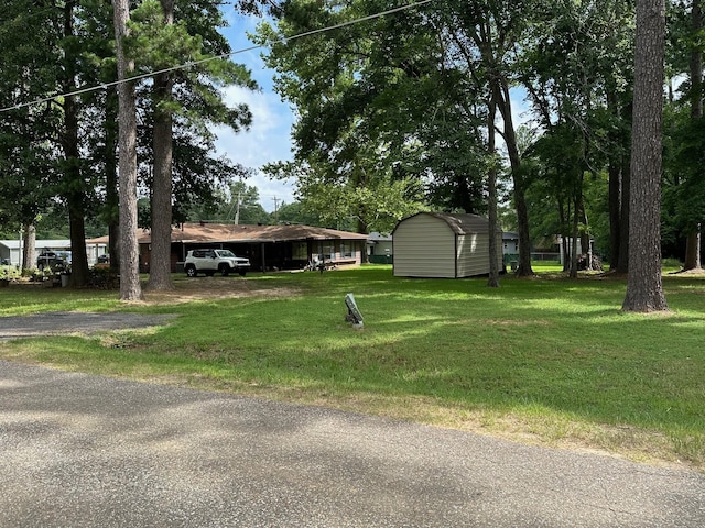 6371 Buncombe Rd, Shreveport, LA 71129 - view of yard with a storage shed and an outbuilding