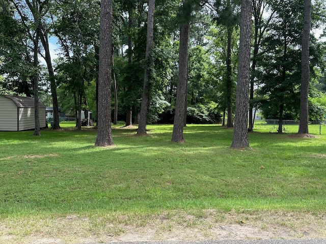6371 Buncombe Rd, Shreveport, LA 71129 - view of yard with an outbuilding, a storage shed, and fence