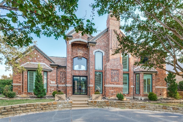 5221 Southern Hills Dr, Frisco, TX 75034 - view of front of property featuring a chimney and brick siding