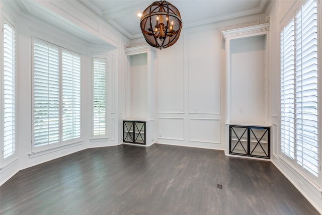 unfurnished room featuring ornamental molding, a chandelier, and dark wood-type flooring