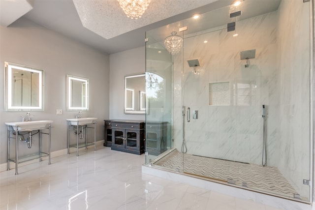 bathroom featuring an enclosed shower, a textured ceiling, and a chandelier