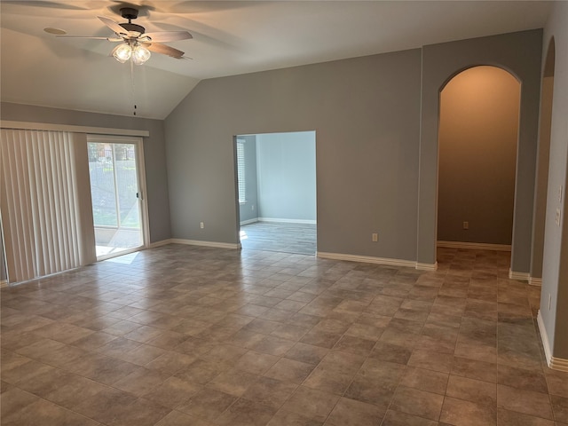 unfurnished room with vaulted ceiling, light tile patterned flooring, and ceiling fan