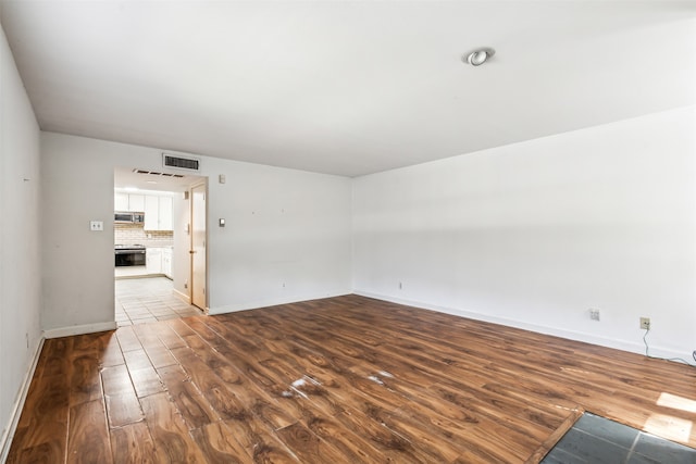 empty room with wood-type flooring