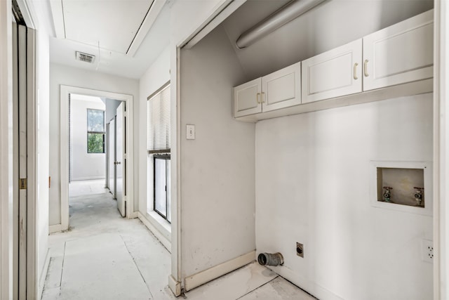 washroom with cabinets, hookup for a washing machine, and electric dryer hookup