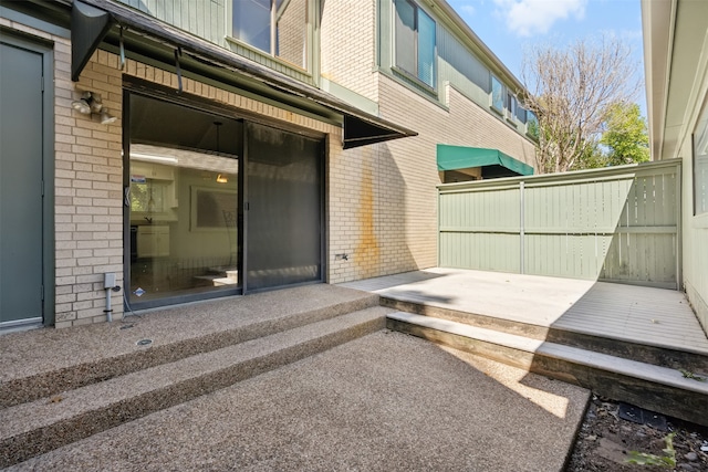 doorway to property featuring a patio area