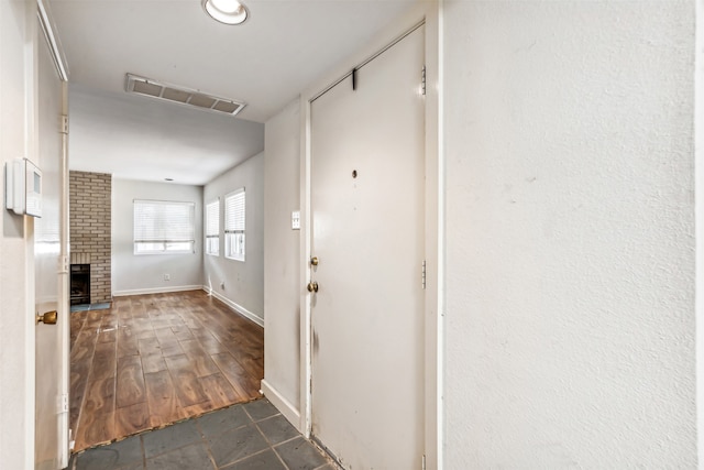 entryway with dark hardwood / wood-style flooring