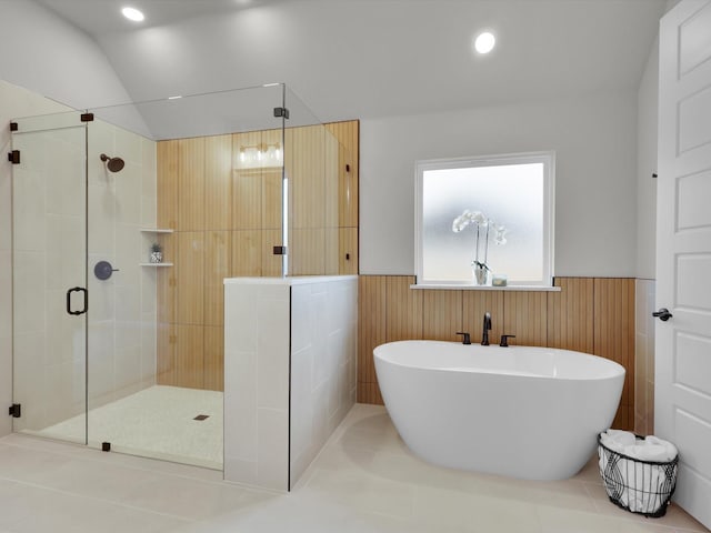 bathroom with shower with separate bathtub and tile patterned flooring