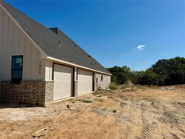 view of property exterior with a garage