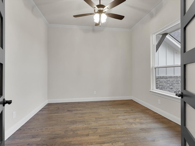 spare room with hardwood / wood-style floors, crown molding, and ceiling fan