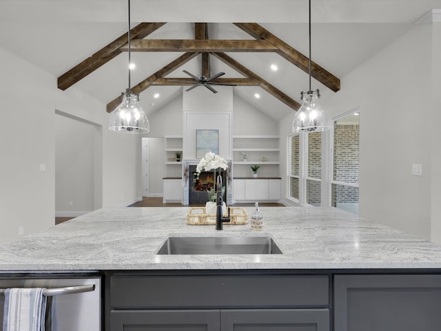 kitchen with gray cabinets, built in features, and decorative light fixtures