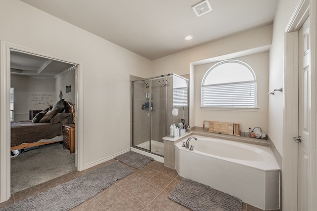 bathroom with shower with separate bathtub and tile patterned floors