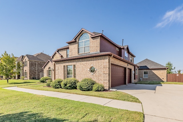 front facade with a front yard and a garage