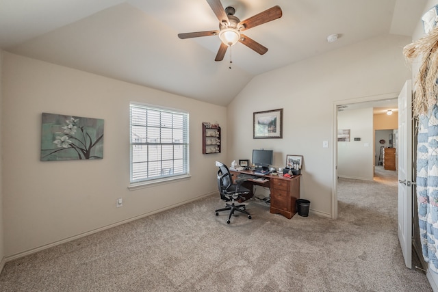 carpeted office space featuring ceiling fan and vaulted ceiling