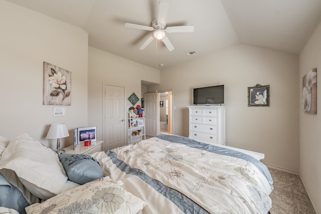 bedroom featuring lofted ceiling, light colored carpet, and ceiling fan