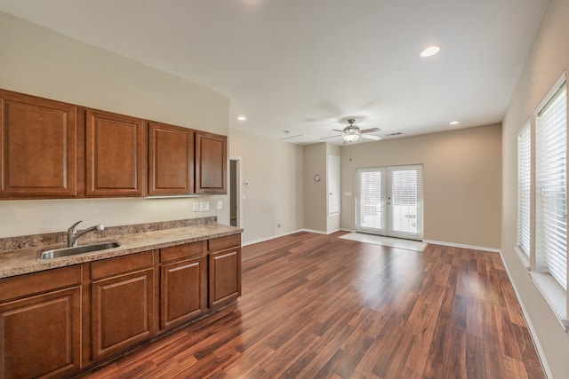 kitchen featuring french doors, ceiling fan, sink, and dark hardwood / wood-style floors