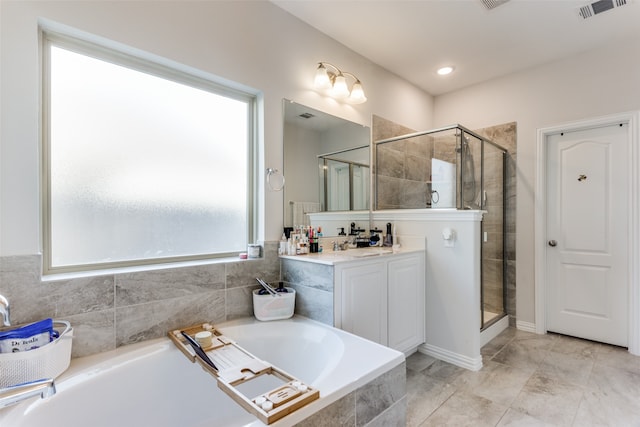 bathroom with vanity and plus walk in shower