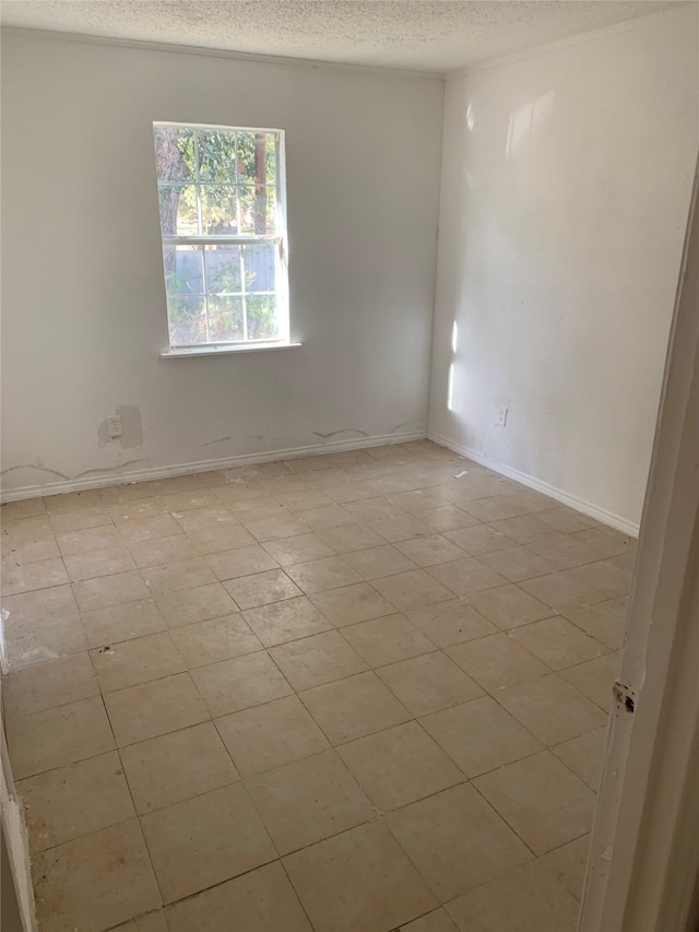 empty room featuring a textured ceiling