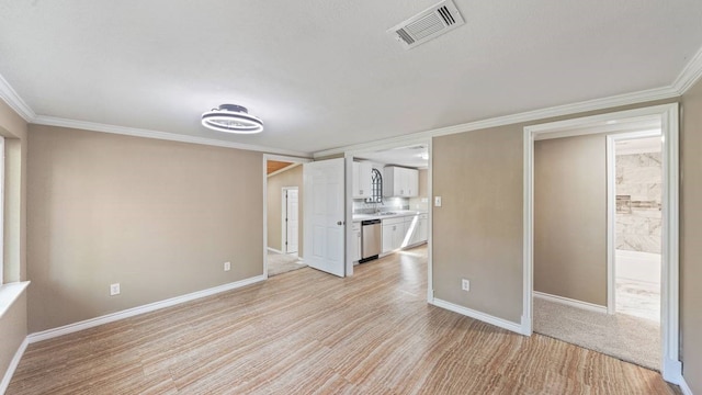 interior space featuring crown molding and light hardwood / wood-style flooring