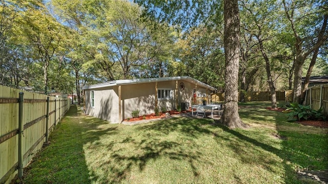 rear view of house with a yard