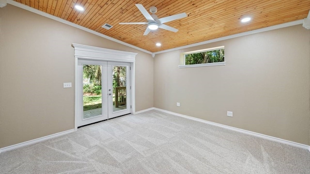 spare room featuring lofted ceiling, crown molding, a healthy amount of sunlight, and wooden ceiling