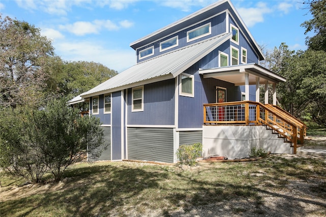 view of home's exterior with a yard