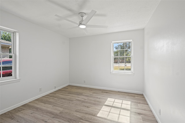 empty room featuring ceiling fan and light wood-type flooring