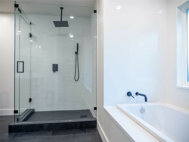 bathroom with plus walk in shower and tile patterned flooring