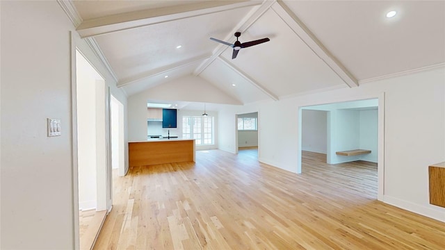 unfurnished living room with vaulted ceiling with beams, light hardwood / wood-style flooring, and ceiling fan