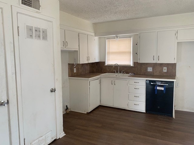 kitchen featuring sink, dark hardwood / wood-style flooring, dishwasher, and white cabinets