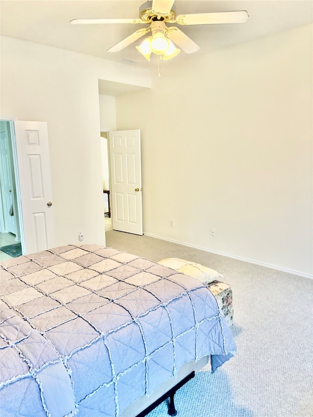 bedroom with ceiling fan and light carpet