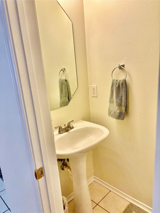 bathroom featuring sink and tile patterned flooring