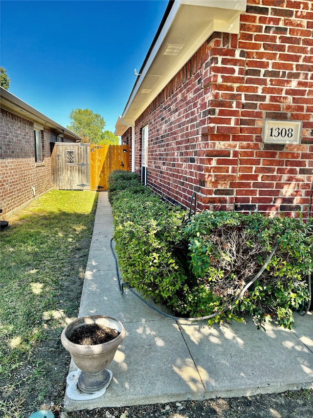 view of property exterior featuring a lawn