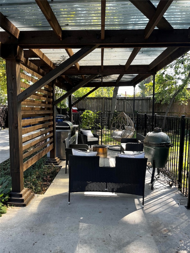 view of patio / terrace with a pergola and area for grilling