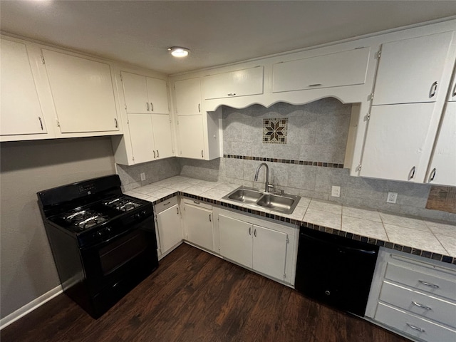 kitchen featuring tile countertops, black appliances, sink, and decorative backsplash