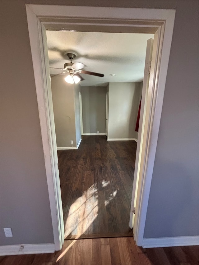 hall with wood-type flooring