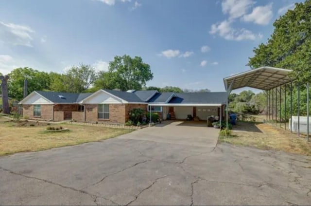 view of front facade with a carport