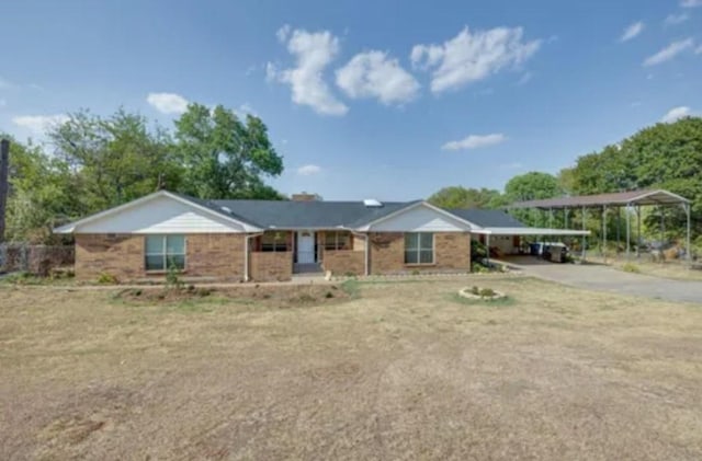 single story home featuring a carport