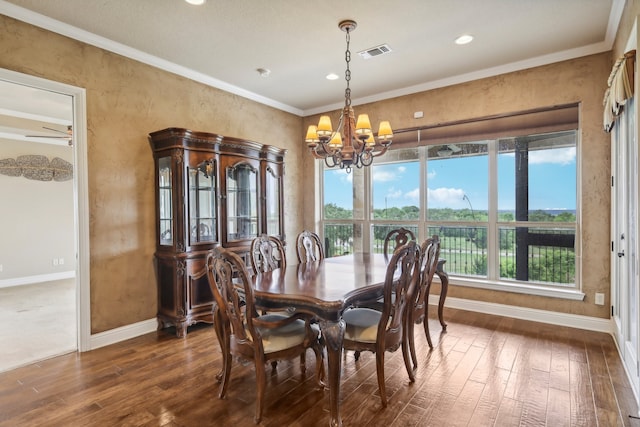 dining space featuring crown molding, dark hardwood / wood-style floors, and ceiling fan with notable chandelier