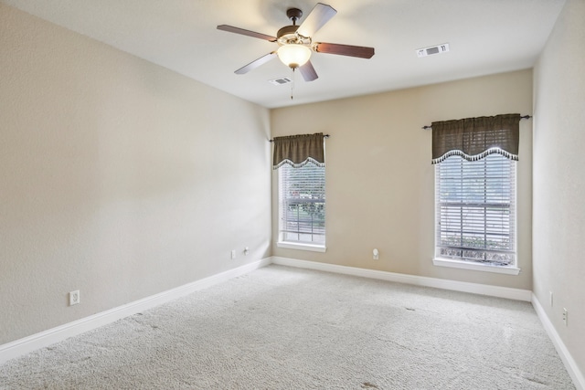 carpeted empty room with ceiling fan