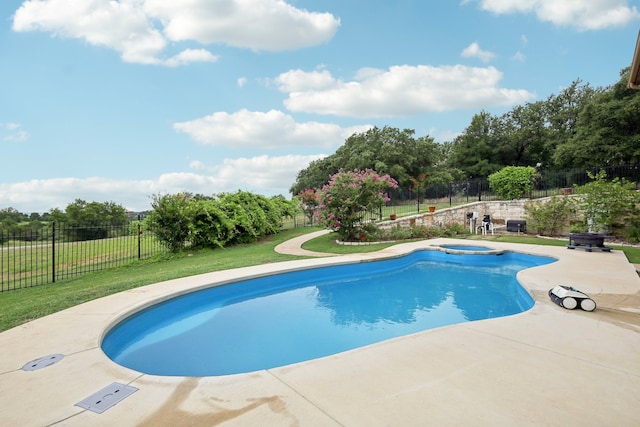 view of pool with a yard and a patio area