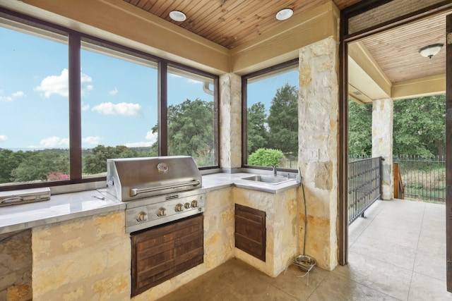 view of patio featuring sink and area for grilling