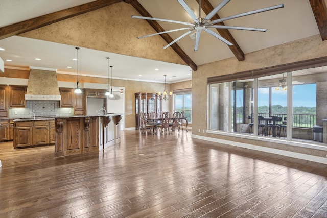 living room featuring beamed ceiling, sink, high vaulted ceiling, ceiling fan with notable chandelier, and dark hardwood / wood-style flooring