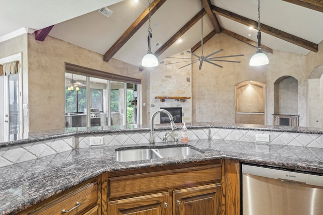 kitchen with sink, lofted ceiling with beams, hanging light fixtures, stainless steel dishwasher, and decorative backsplash