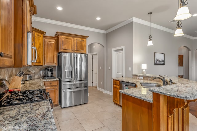 kitchen featuring an island with sink, stainless steel appliances, light tile patterned flooring, decorative light fixtures, and light stone counters