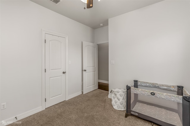 carpeted bedroom featuring ceiling fan