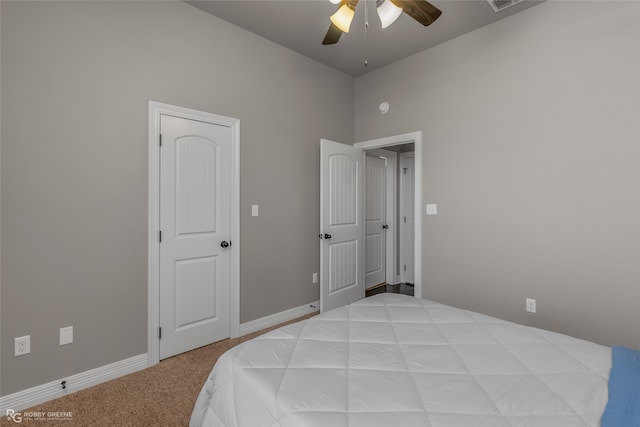 bedroom with light carpet and ceiling fan